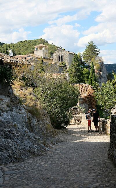 Walking along a cobbled road in Ardèche, France. Unsplash:Laura V