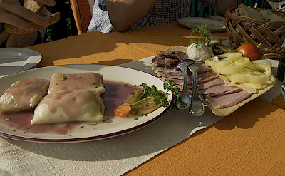 Slovenia lunch of cheese dumplings and cold cuts. Flickr:claire rowland