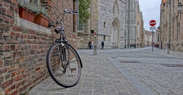 Biking in Bruges, Belgium. Photo via Flickr:nanpalmero