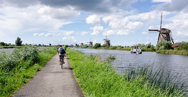 Biking the famous Kinderdijk, South Holland, the Netherlands. Photo via Flickr:Luca Casartelli