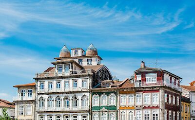 Blue skies over buildings in Guimaraes, Portugal. Unsplash:Bruno Martins