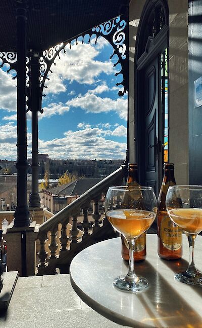 Glasses of beer overlooking Salamanca, Portugal. Unsplash:Leosprspctive