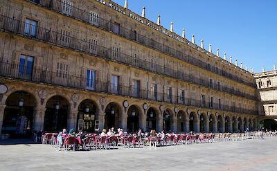 People dining outside in Salamanca, Portugal. Unsplash:Beth MacDonald