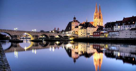 Regensburg at night along the Danube River in Germany. Photo via Creative Commons:Ulrich Oestringer