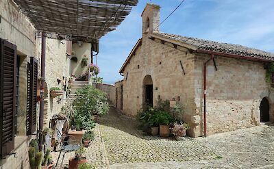 Cobblestone square in Montefalco, Italy. Unsplash@Andrea Pasquali