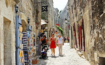 Shopping alley in Les Baux de Provence, France. Flickr:Andrea Schaffer