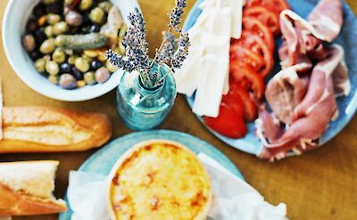 Quiche, olives, bread and ham. France bike tour. Unsplash@Ellena McGuinness