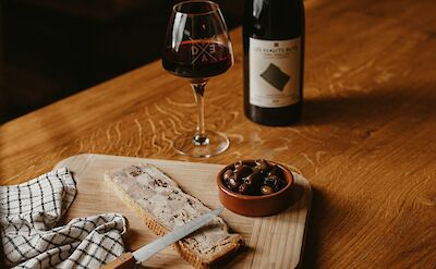 Red wine and pate. France bike tour. Unsplash@Martin Baron
