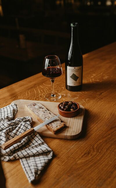 Red wine and pate. France bike tour. Unsplash@Martin Baron