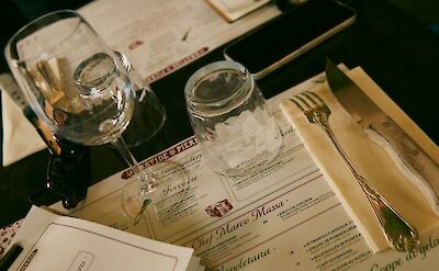 Restaurant menu in Gordes, France bike tour. Unsplash@Tamara Harhai