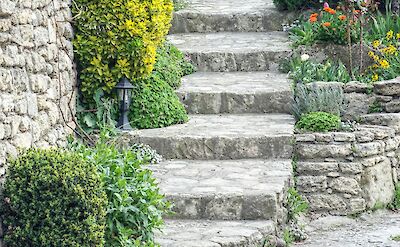 Stone steps in Bonnieux, France bike tour. Unsplash@Frederic Barriol
