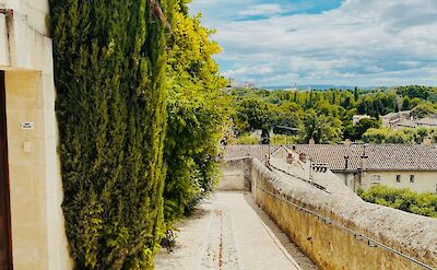 Walled pathway in Avignon, France bike tour. Unsplash@Jurre Houtkamp