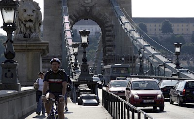 Biking the Chain Bridge in Budapest, Hungary.
