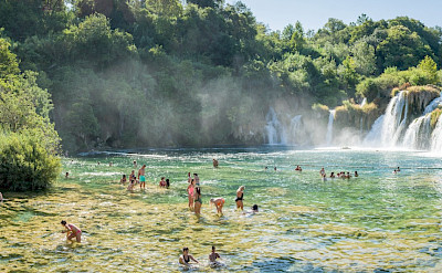 Swimming at Skardin waterfall in Croatia. Flickr:Luca Sartoni