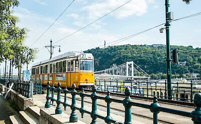 A yellow tram in Budapest, Hungary. Unsplash@Arvydas Venckus