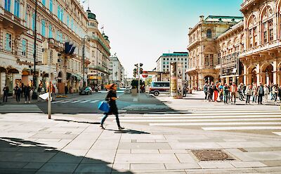 Lady walking through the streets of Vienna, Austria. Unsplash@Dan V