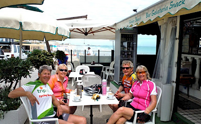 Hennie, Sally and friends taking a break from their ride along the Adriatic Sea in Riccione, Italy. Photo by Sally Fishbeck