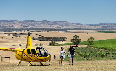 Walking out of the helicopter, Barossa Valley, Australia. CC:Barossa Helicopters
