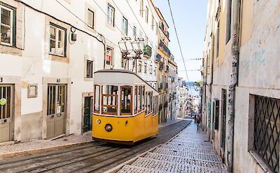yellow Cablecar in Lisbon, Portugal. Andre Lergier@Unsplash