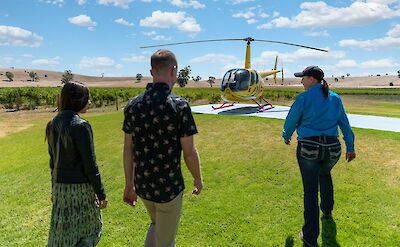 Walking to the helicopter, Barossa Valley, Australia. CC:Barossa Helicopters