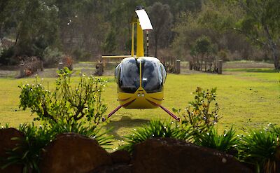 Helicopter behind foliage, Barossa Valley, Australia. CC:Barossa Helicopters