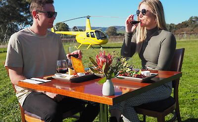 Wine tasting outside Kies Family Wines, Barossa Valley, Australia. CC:Barossa Helicopters
