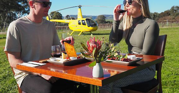 Wine tasting outside Kies Family Wines, Barossa Valley, Australia. CC:Barossa Helicopters