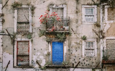 Blue bricks for windows in a house in Alfama, Lisbon, Portugal. Alistair Macrobert@Unsplash