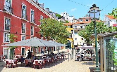 Outdoor dining with Tuk Tuks on the wait, Alfama, Lisbon, Portugal. Alexander Gilmour@Flickr