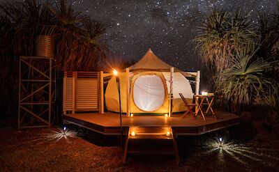 Lotus tent under a starry night sky, Darwin, Australia. CC:Top End Safari Camp