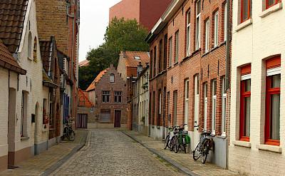 Quiet cobblestone street in Bruges, Belgium. Flickr:Elroy Serrao