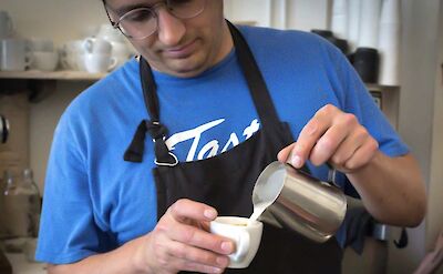 Barista pouring the perfect cup in a shop in Portland, Oregon, USA. CC: Lost Plate