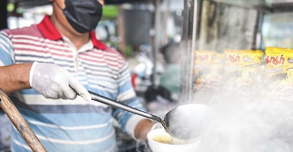 local merchant serving up noodles, Phnom Penh, Cambodia. CC: Lost Plate