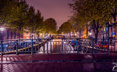 Many canals circumvent Amsterdam in North Holland, the Netherlands. Flickr:syuqoraizzat