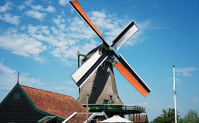 Orange blades on a windmill at Zaanse Schans, Netherlands. Unsplash:Fabio Romano