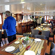 Dinning room set for service on Magnifique | Bike & Boat Tours