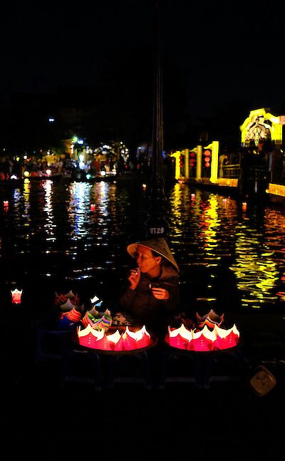 A woman with lanterns, Hoi An, Vietnam. Unsplash:Dheepak Mahesh