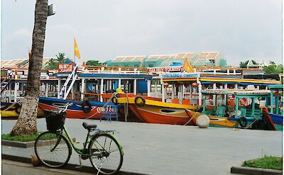 Bike parked next to the river in Hoi An, Vietnam. Unsplash:Bui Ngoc