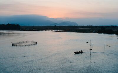 Fishing boat at sunset, Hoi An, Vietnam. Unsplash:Pete Walls