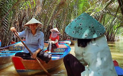 Paddling boats along the Mekong Delta, Vietnam. Unsplash:Rushikesh Patil