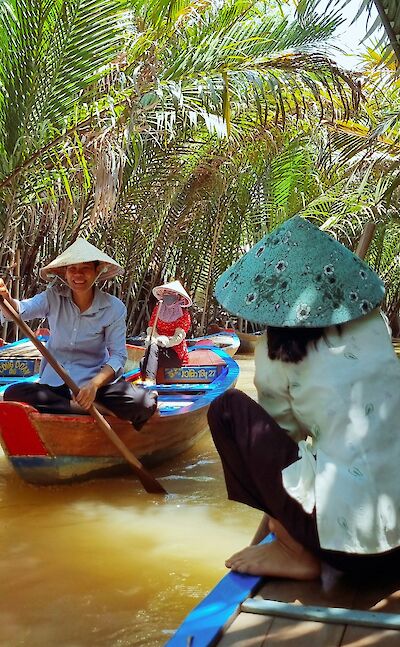 Paddling boats along the Mekong Delta, Vietnam. Unsplash:Rushikesh Patil