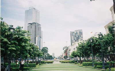 Tree-lined street, Ho Chi Minh City, Vietnam. Unsplash:Chou Vu