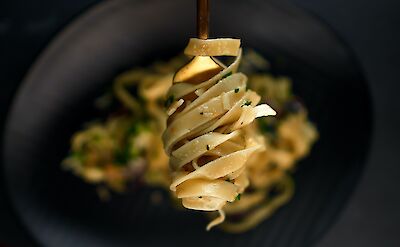 A fork of pasta, Rome, Italy. Jean-Claude Attipoe@Unsplash