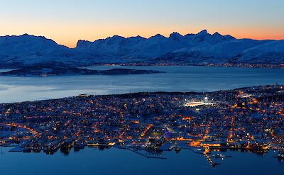 The twinkling lights of Tromso, Norway. Unsplash: Harry Jaschhof