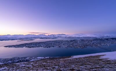 Tromso viewed from afar, Norway. Unsplash: Pascal De Brunner
