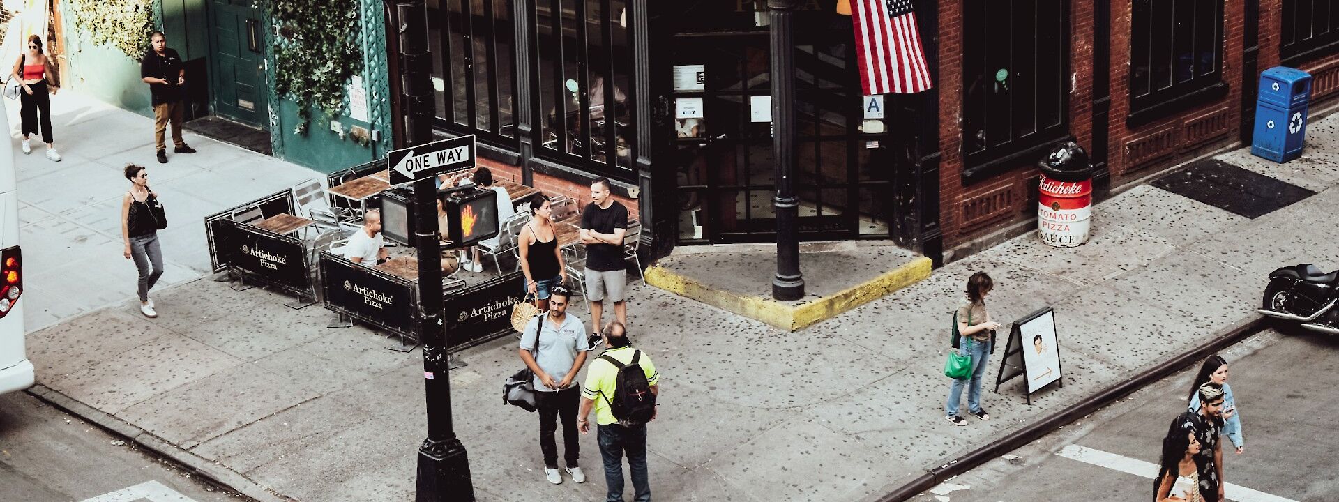 People outside the Artichoke Basilles Pizza, Greenwish Village, New York, USA. Unsplash: Krisztina Papp