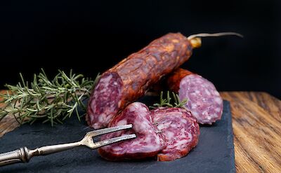 Delicious Salami on a plate, New York, USA. Unsplash: Wesual Click
