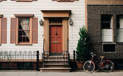 Bike by the steps, House in West Village, New York, USA. Unsplash: Christian Koch