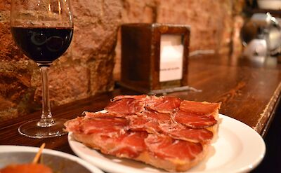 A glass of wine and a serving of palma ham, Barcelona, Spain. Flickr: Annie and Andrew
