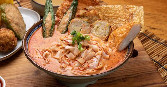 Rich topped noodles from Singapore, Singapore. Unsplash: Yu Jinyang